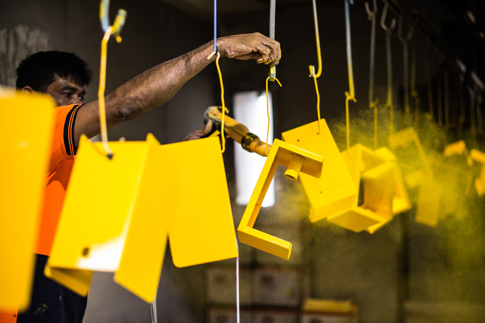 Man Applying Powder Coating